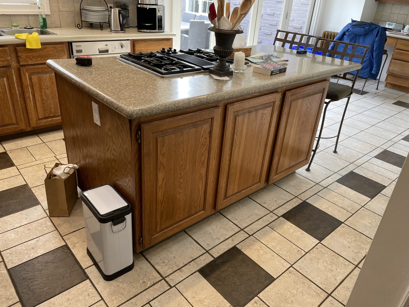 Before: oak kitchen island with speckled countertop in a Shaughnessy, Vancouver home
