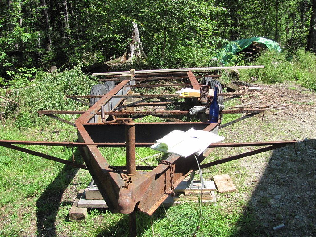 Timber frame of a small building addition standing on a new foundation
