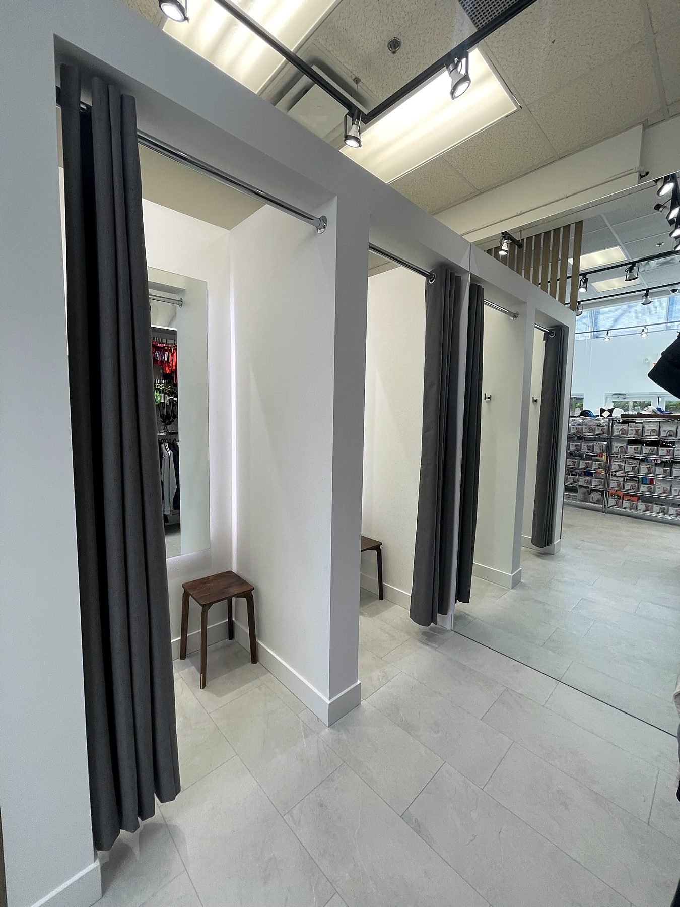 Two new fitting rooms with full-height curtains in a Downtown Vancouver retail store