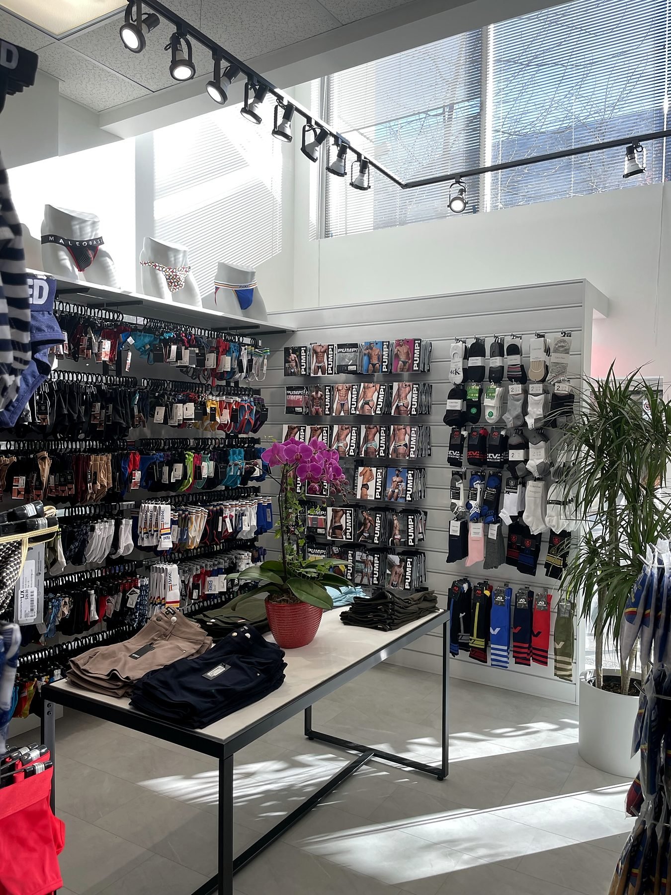 Finished Top Drawers Apparel store in Downtown Vancouver with slatwall displays and black track lighting
