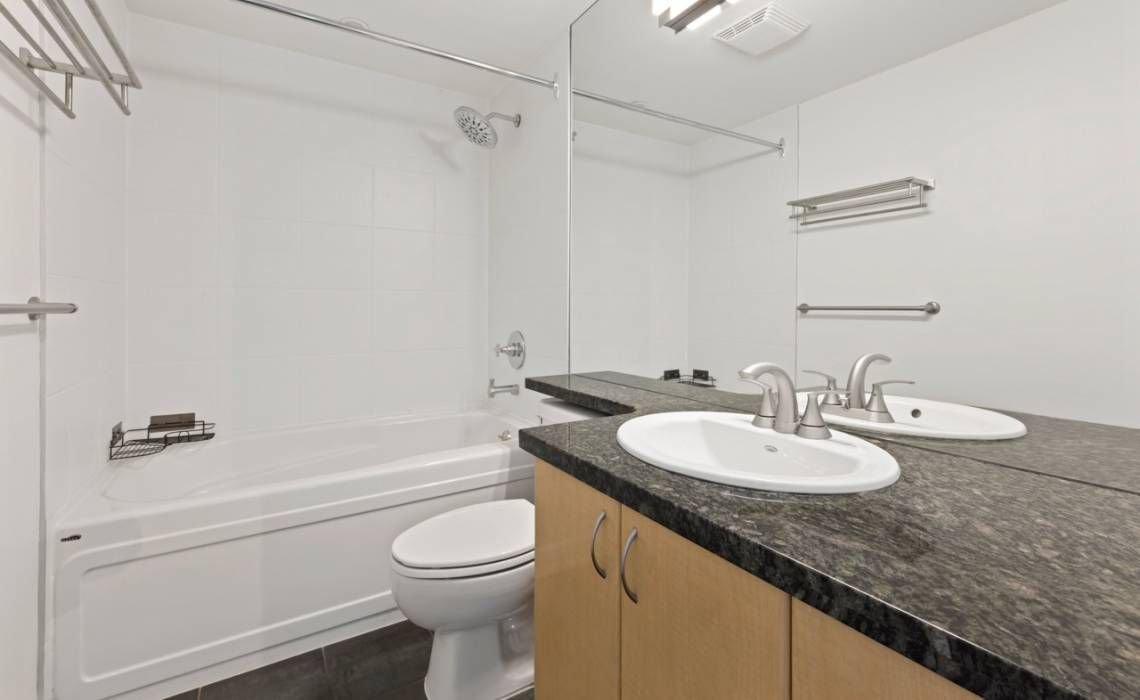 Before: original vanity in a Yaletown condo bathroom