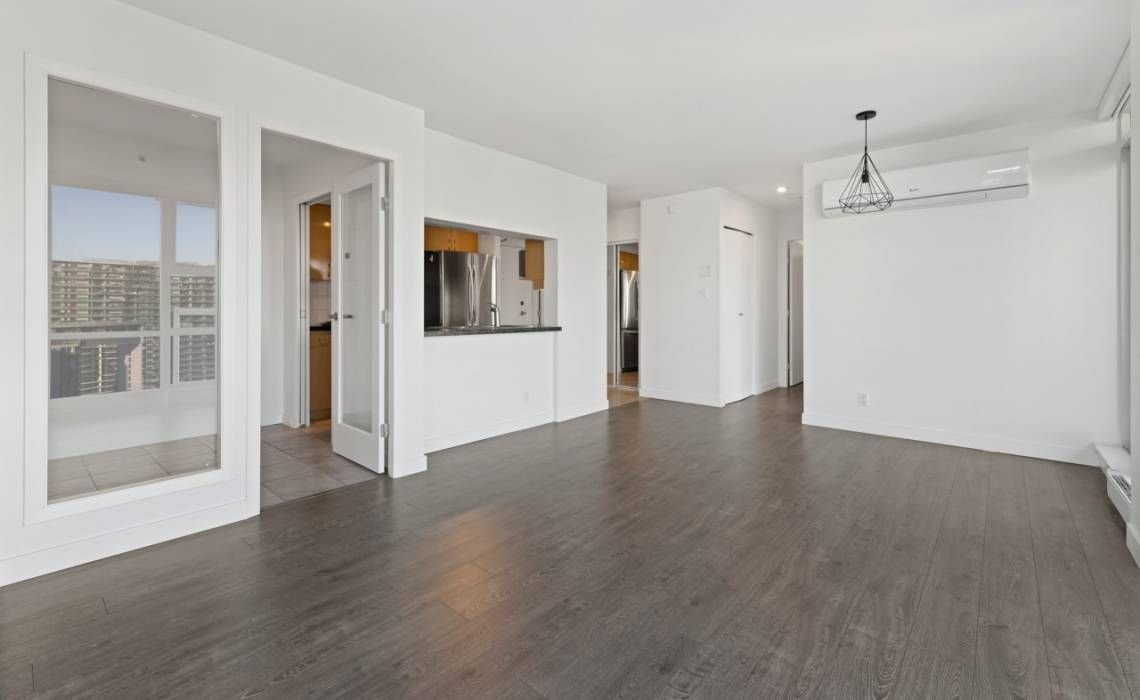 Before: closed condo kitchen behind a wall and bulkhead in a Yaletown suite