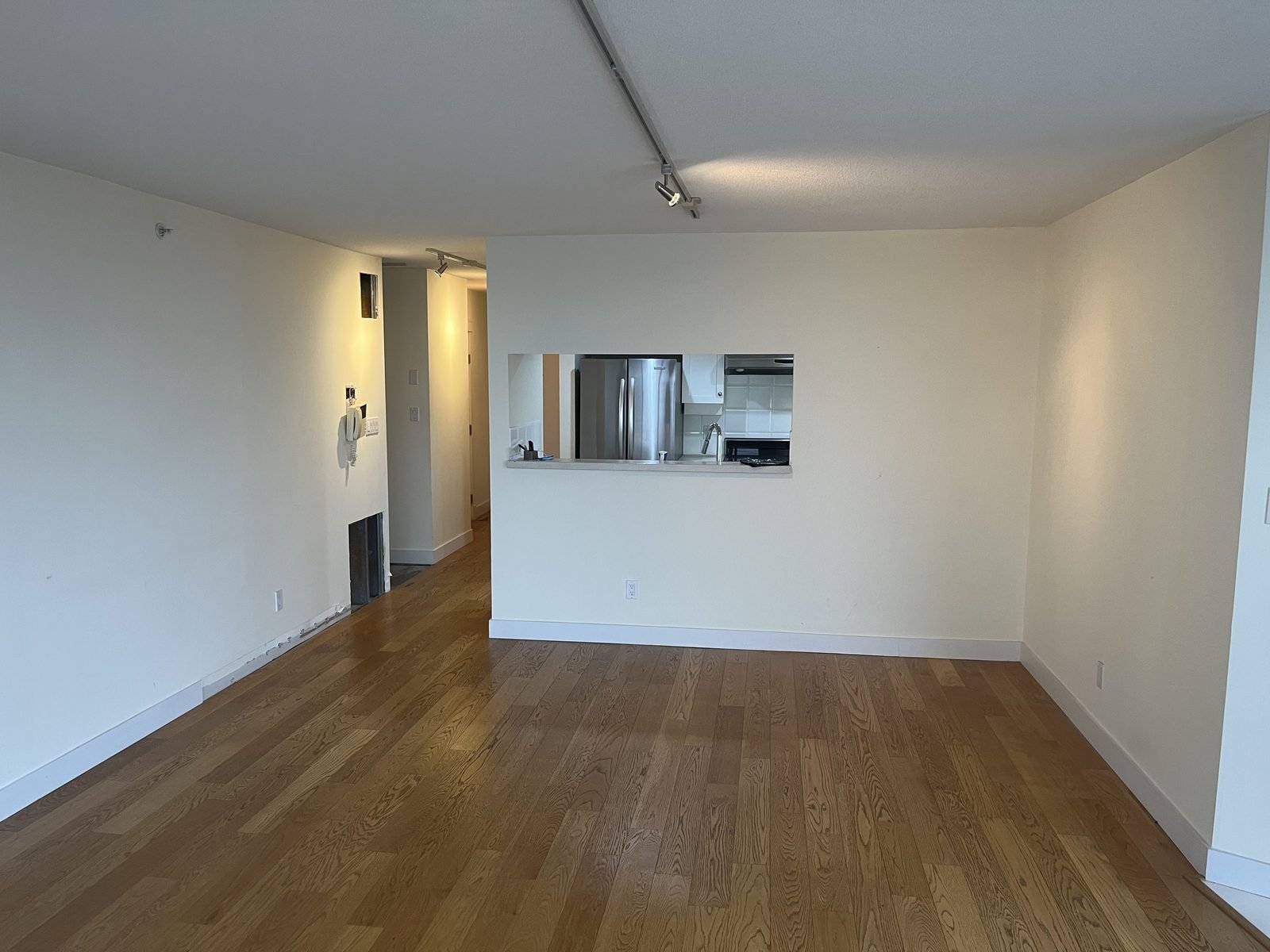 Before: closed Yaletown condo kitchen behind a wall with a small pass-through opening